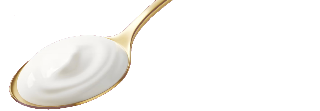 Golden spoon with a scoop of yoghurt